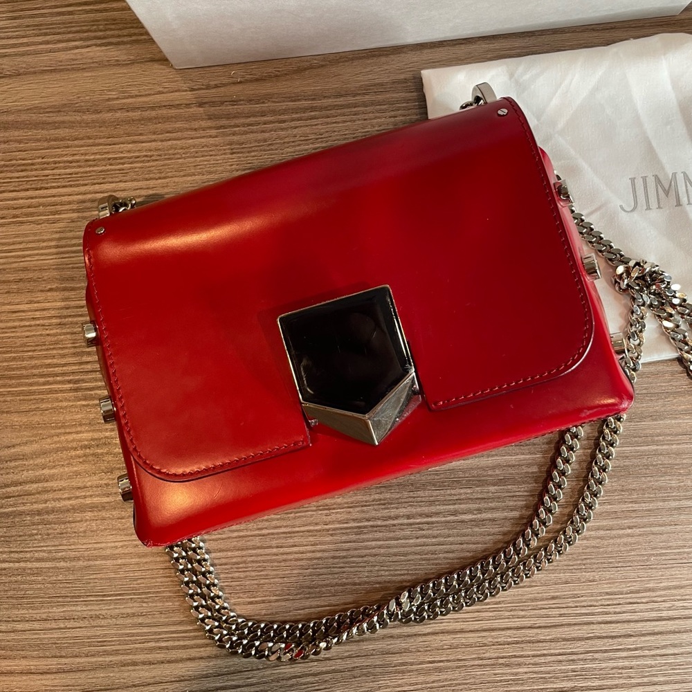 Red Jimmy Choo bag with beautiful silver hardware. Heavy duty, sturdy bag.